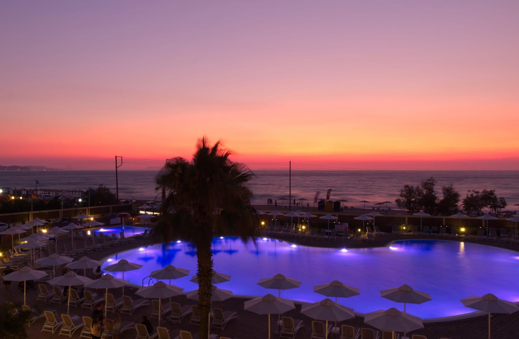 Almyros Beach Almiros Beach Bagian luar foto Sunset at a resort in Crete
